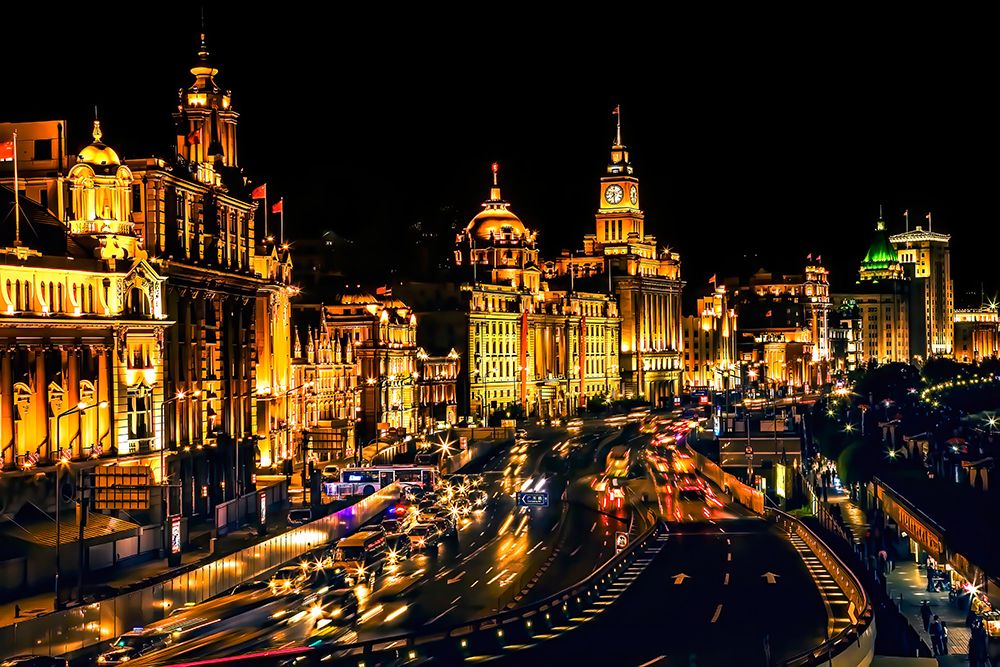 The Bund, old part of Shanghai, China, Night Illuminated with cars.